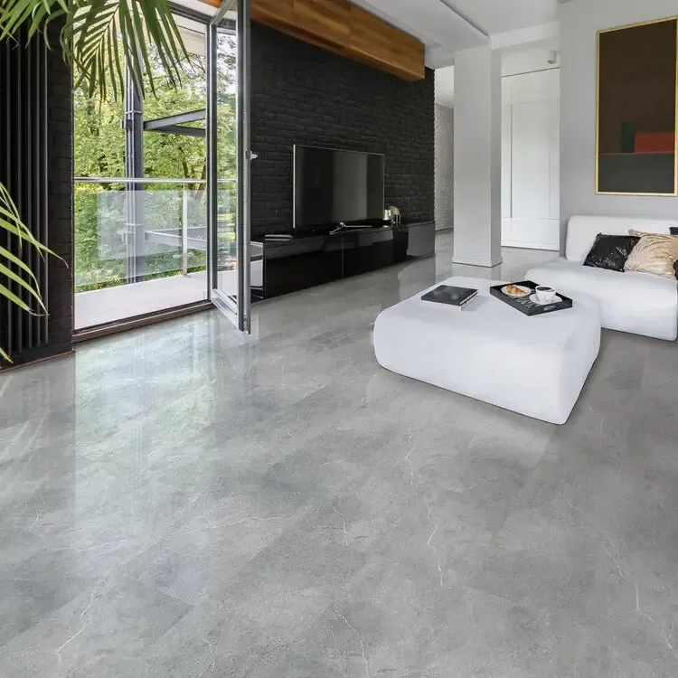Modern living room with open balcony. Gray marble floor, white sofa, black TV, and dark wall.