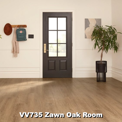 A room with Zawn Oak flooring, a dark door, and a coat rack on the wall.