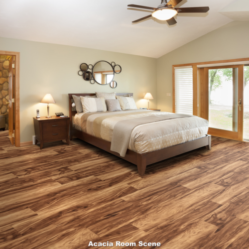 Bedroom with wooden floors, bed, ceiling fan, and sliding doors.