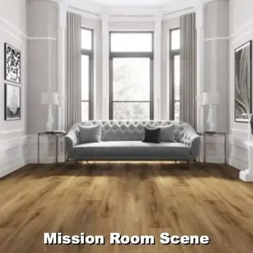 Living room with grey sofa, large windows, wood floor, and artwork on the walls.