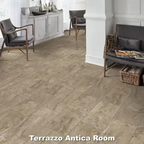 Room with light brown tile floor, two armchairs, and a cabinet.