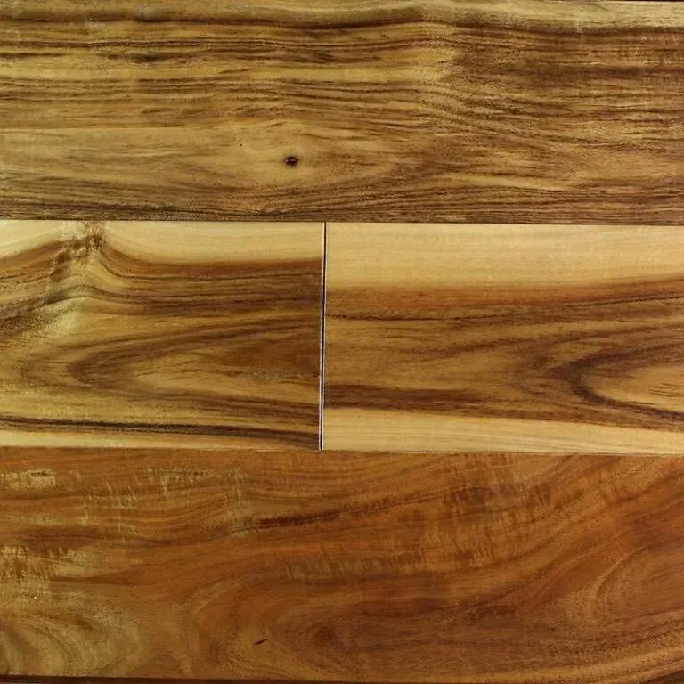 Close-up of acacia hardwood flooring with varied brown and tan tones.