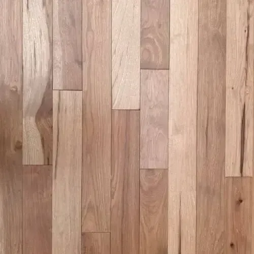 Hardwood floor with vertical planks in varying shades of tan and brown.