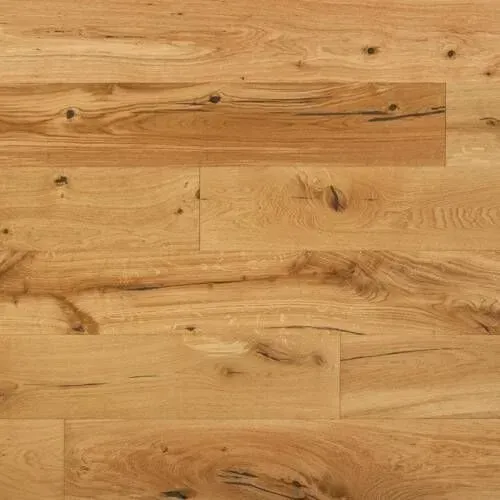 Light brown hardwood flooring with wood grain and knots.