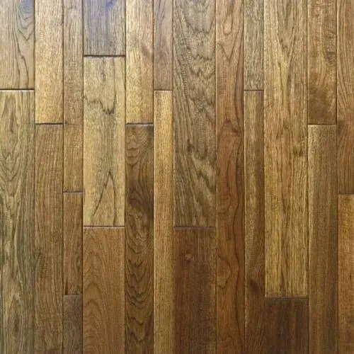 Wooden floorboards in various shades of brown, arranged vertically.