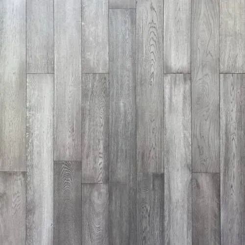 Gray wood flooring with vertical planks and visible wood grain.