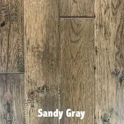 Sandy gray hardwood floor with wood grain and knots.