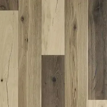 Wood flooring with varying shades of brown and tan planks, displaying wood grain patterns.