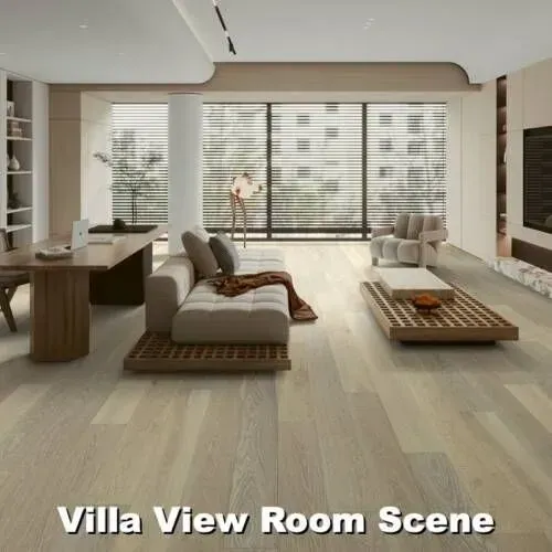 Modern living room with light wood floors, large windows, and neutral-toned furniture.