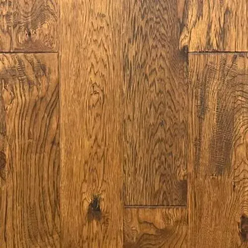 Close-up of a brown hardwood floor with visible wood grain and knots.