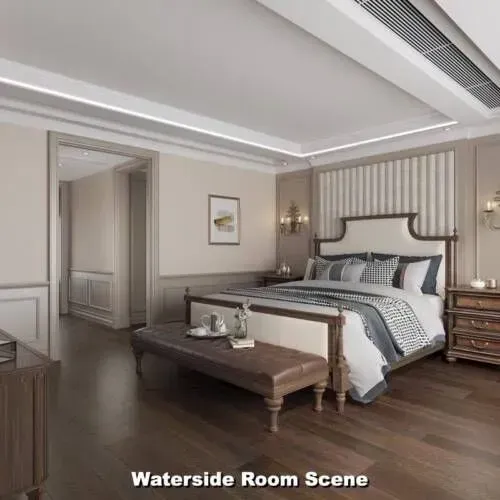 Elegant bedroom interior with a large bed, bench, and wooden furniture.