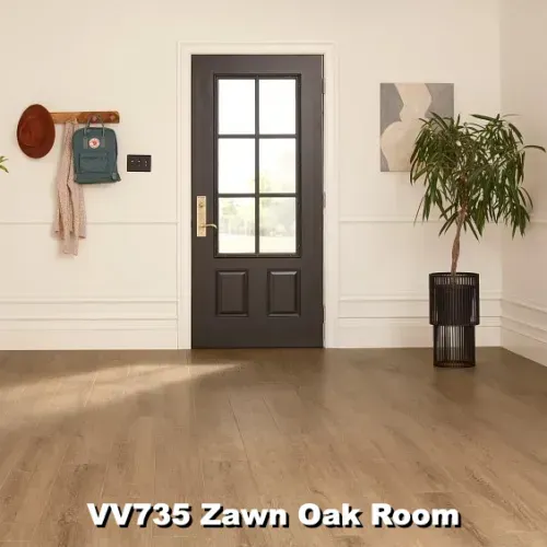 A room with Zawn Oak flooring, a dark door, and a coat rack on the wall.