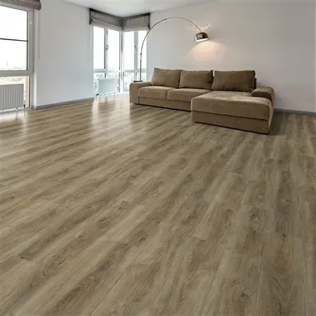 Living room with light brown wood-look flooring, a beige sectional sofa, and a tall arched lamp.