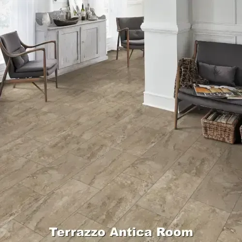 Room with light brown tile floor, two armchairs, and a cabinet.