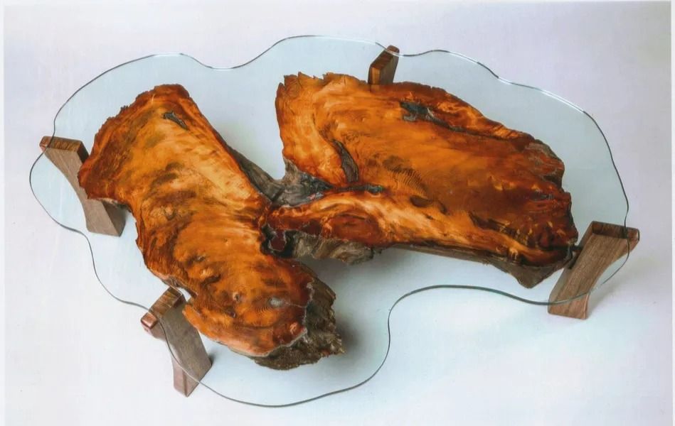 Two grilled meat pieces on a plate with small wooden clips