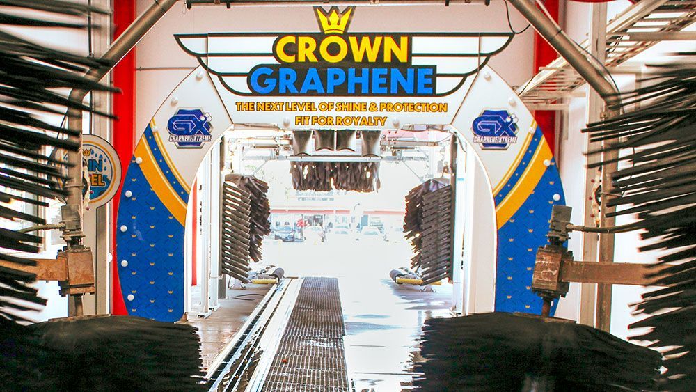 A car wash with a sign that says crown graphene