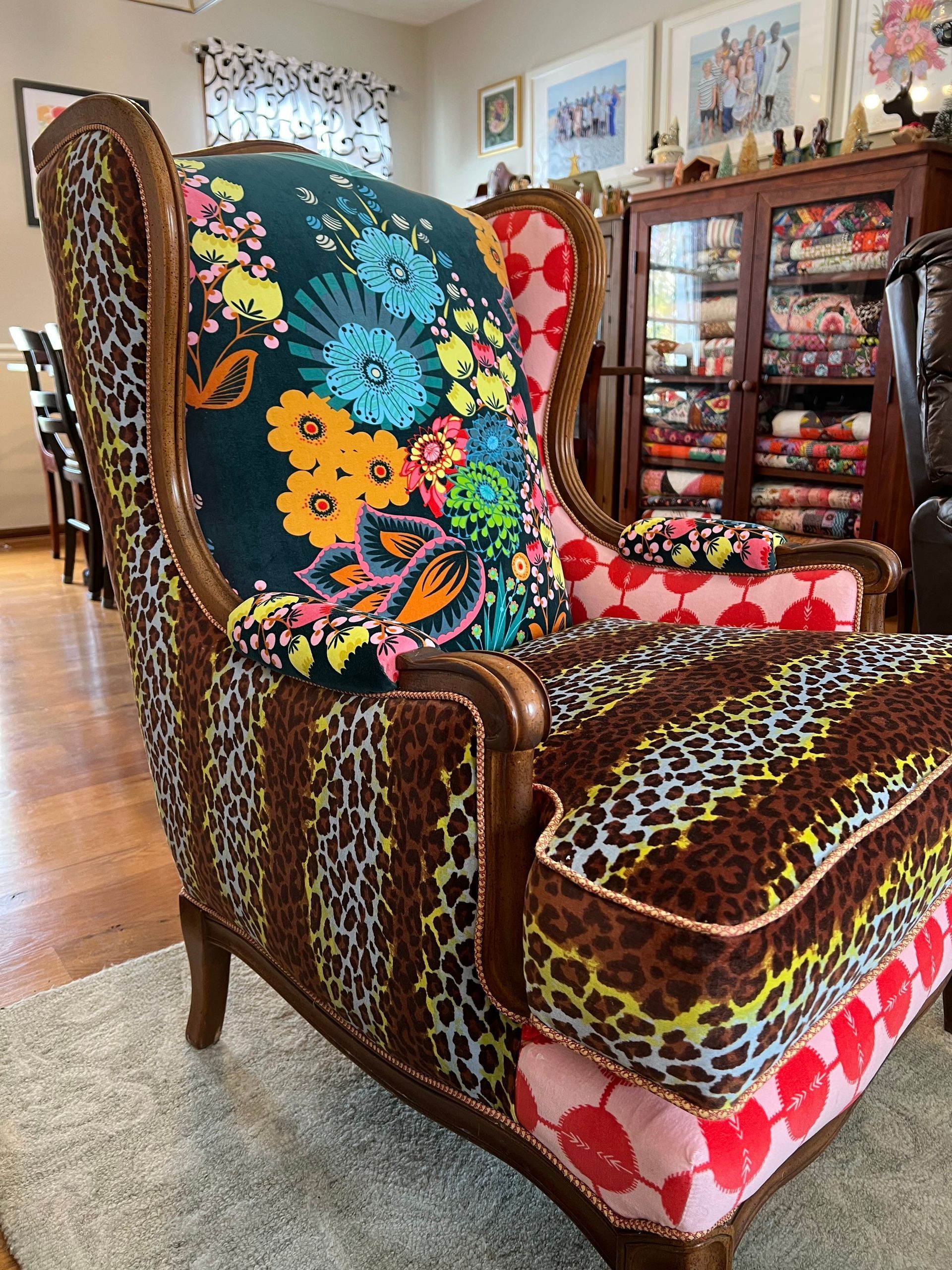 Colorful patchwork armchair with patterned fabric in a cozy living room