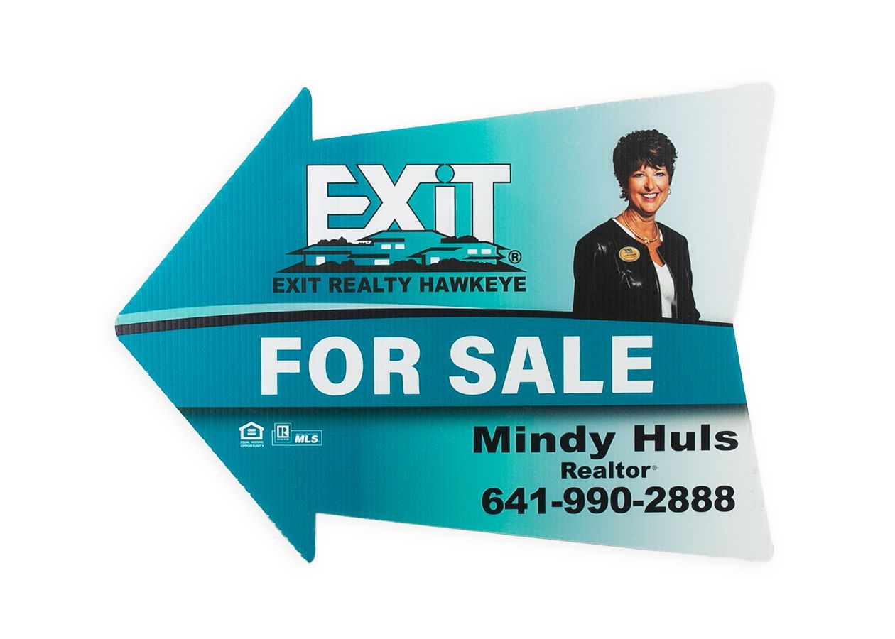 a for sale sign for exit realty