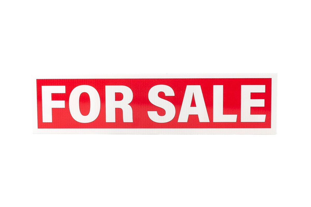 a red sign that says `` for sale '' on a white background .