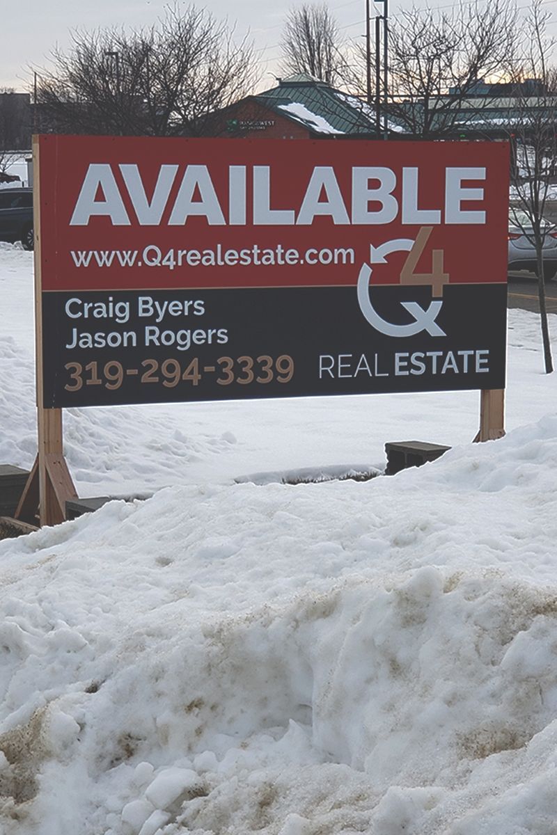 a red and black sign that says available on it