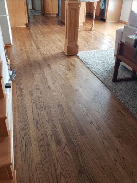 a living room with hardwood floors and a couch