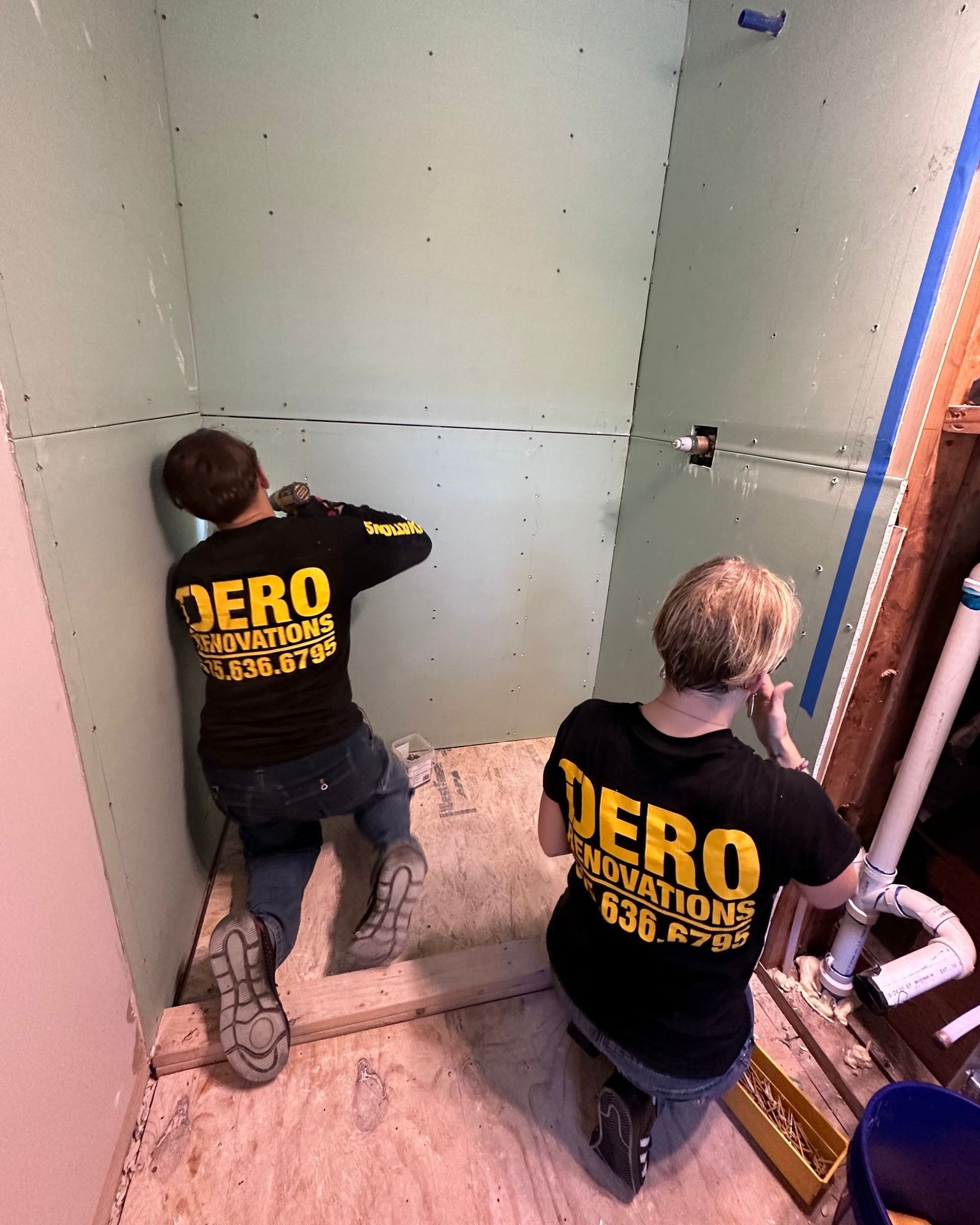 Two people wearing black shirts with 