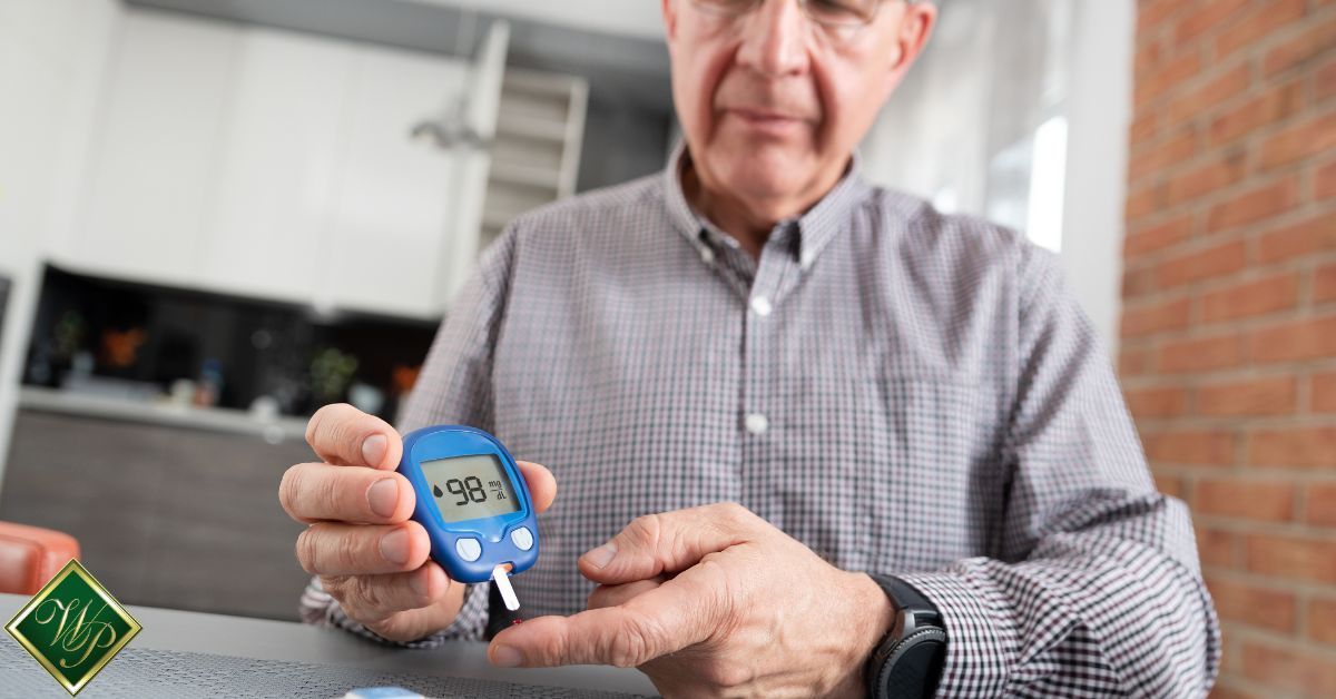 elderly man checking his blood sugar - Whispering Pines diabetes management