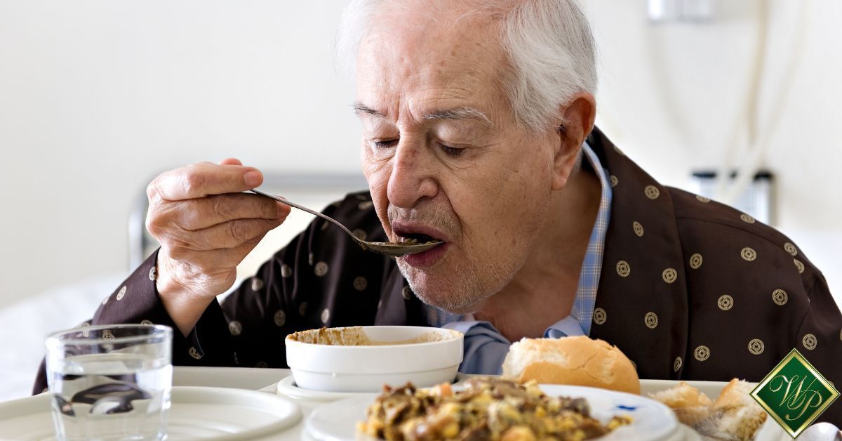 elderly man eating soup with a spoon - Whispering Pines nutrition in assisted living homes