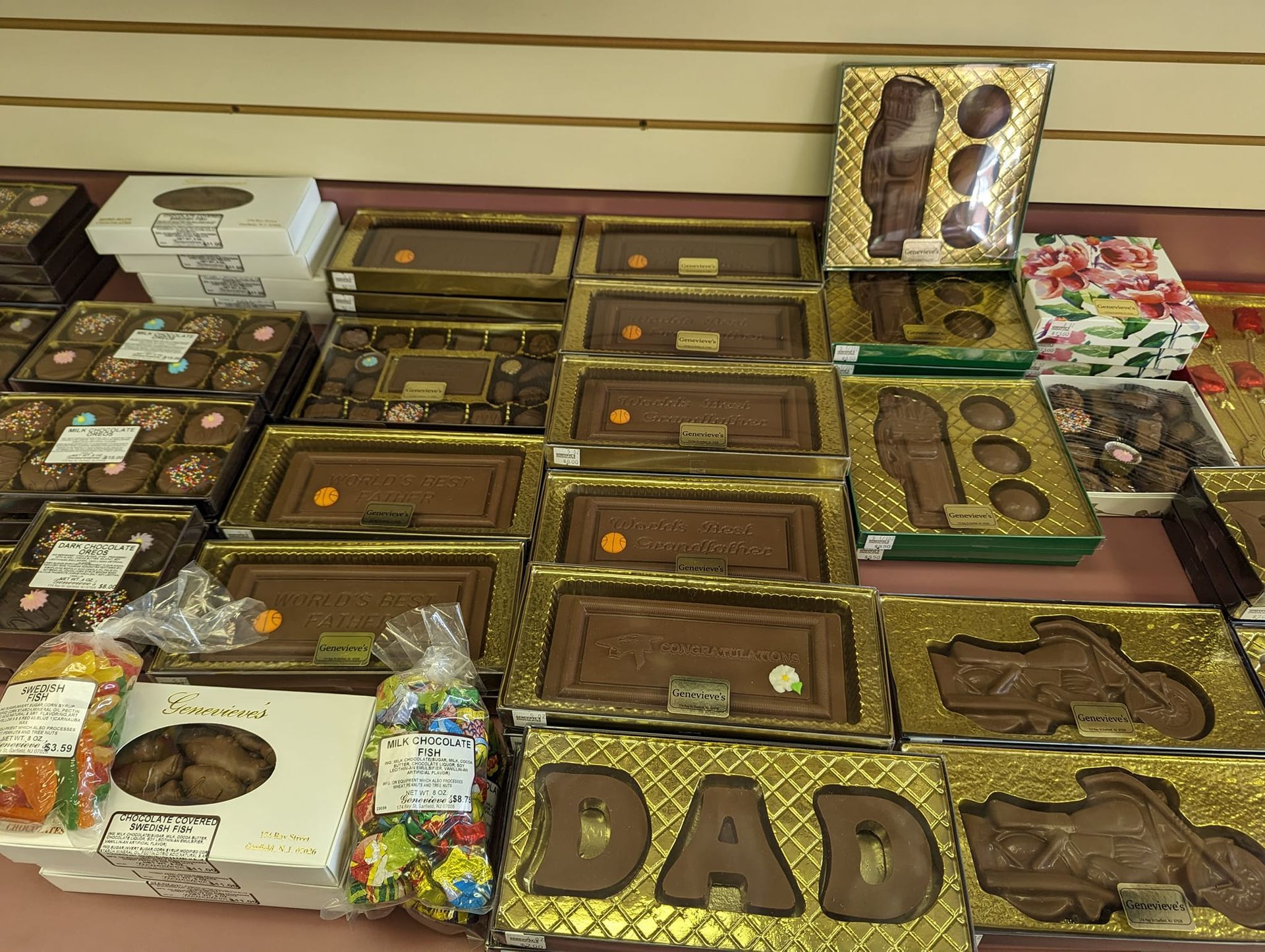 Various chocolate gifts on display: chocolate bars, boxes, and 