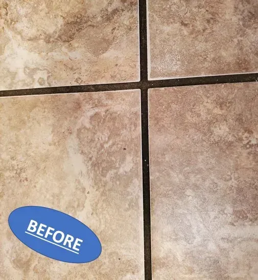 Close-up of beige tiled floor with dark grout lines and a blue “BEFORE” sticker in the corner