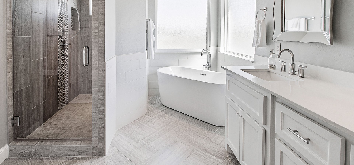 Blue mop cleaning white tile floor with brown stains