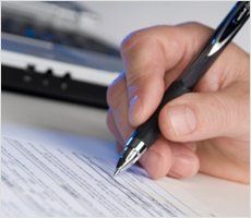 Copywriter composing resume with pen