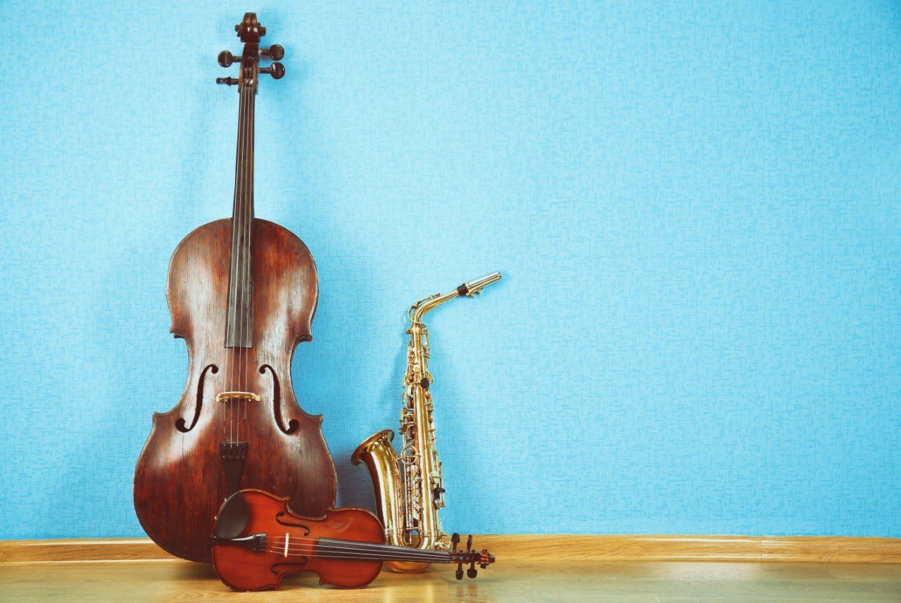 A cello, a violin, and a saxophone