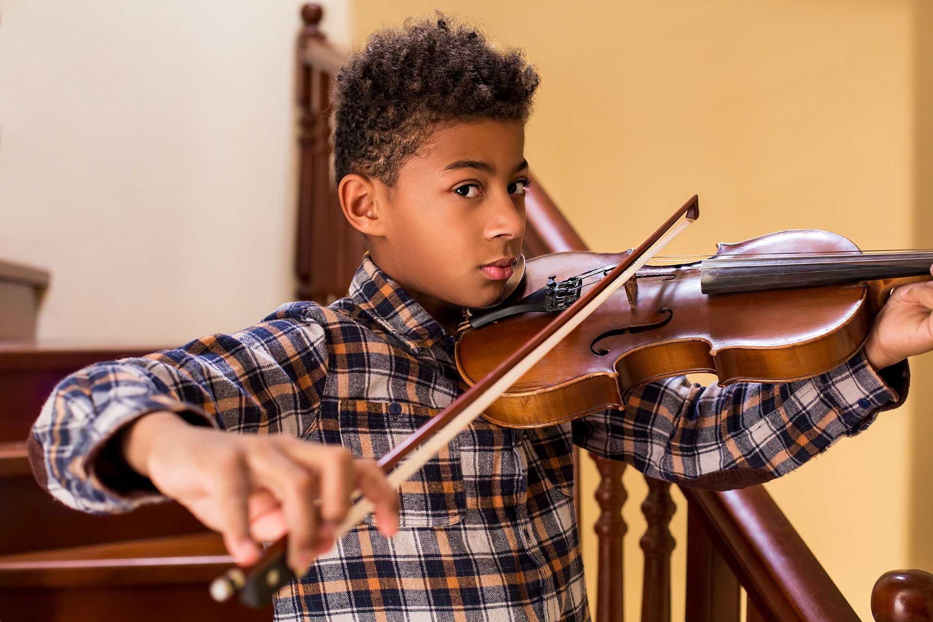 boy playing a violin