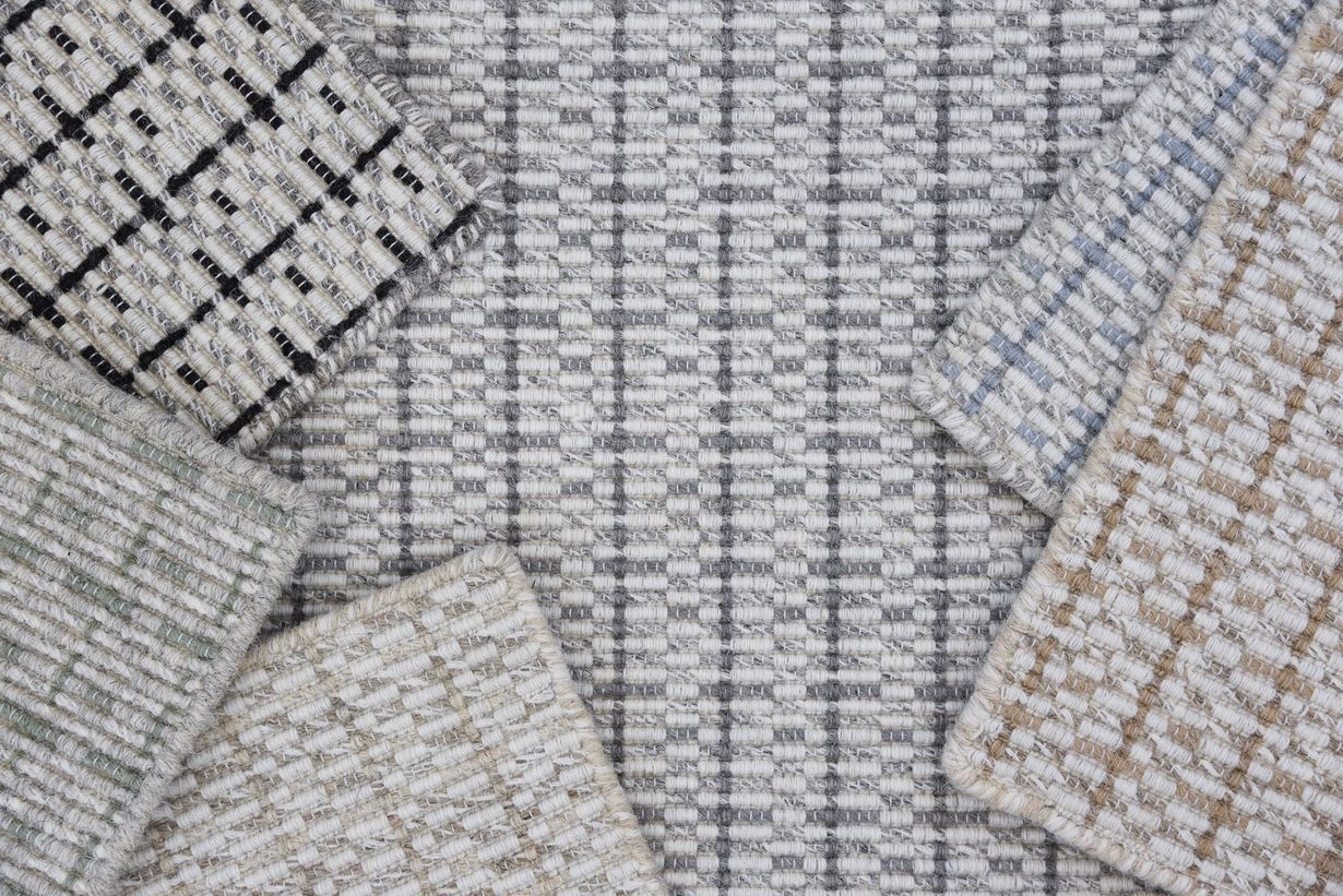 There are many different types of rugs and carpets in this picture.