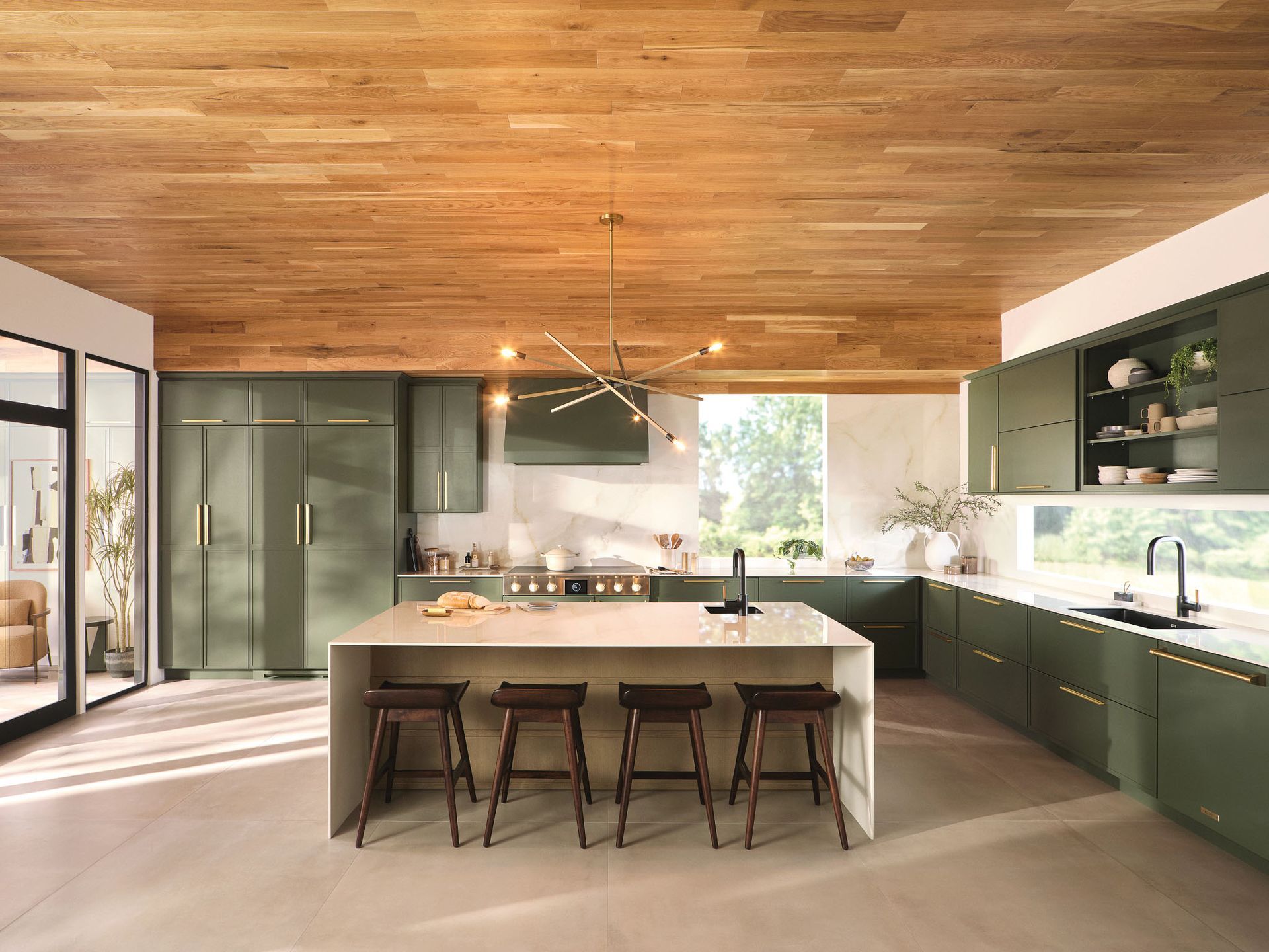 A kitchen with green cabinets and a wooden ceiling.