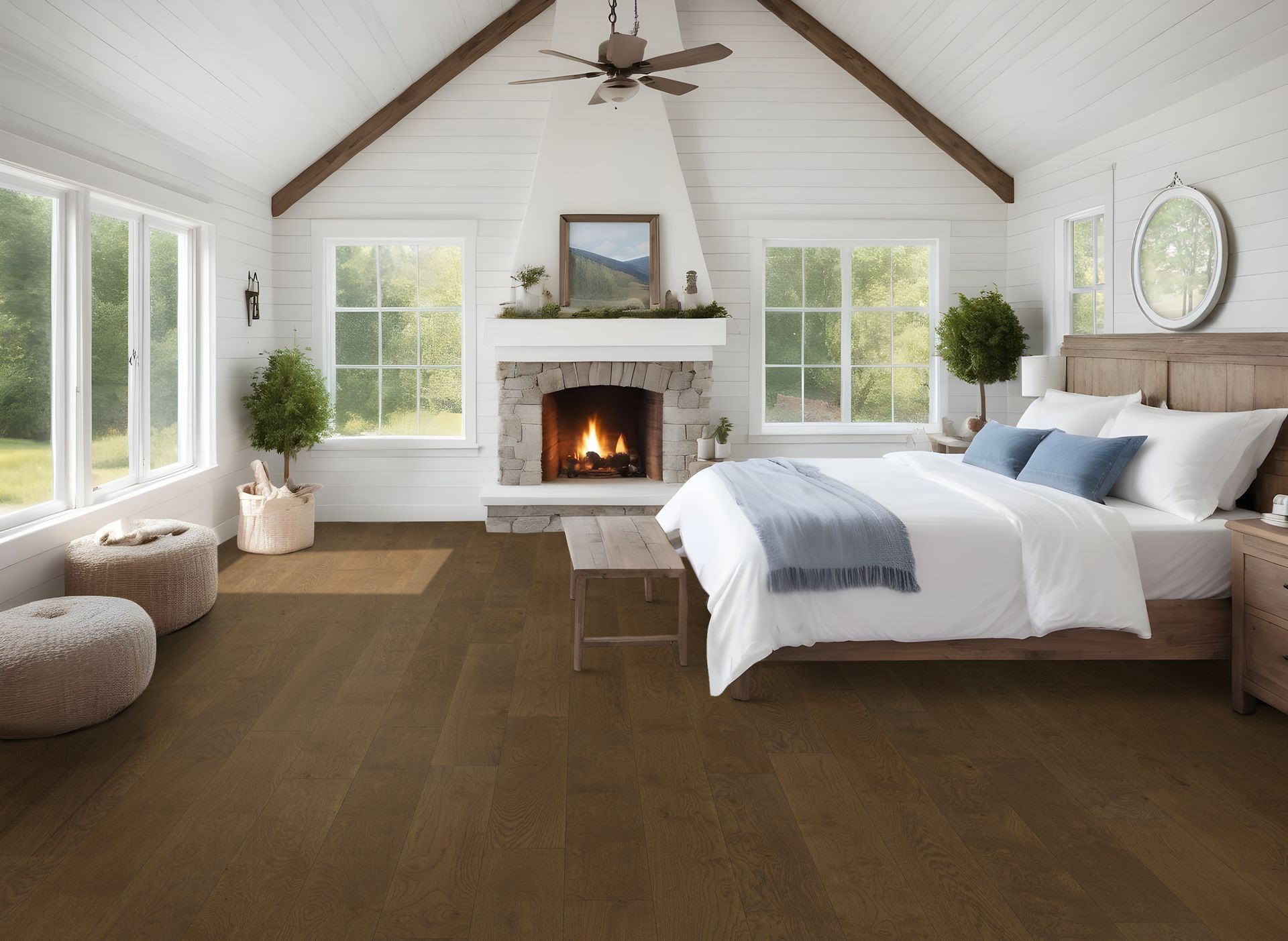 A bedroom with a bed , fireplace , and lots of windows.