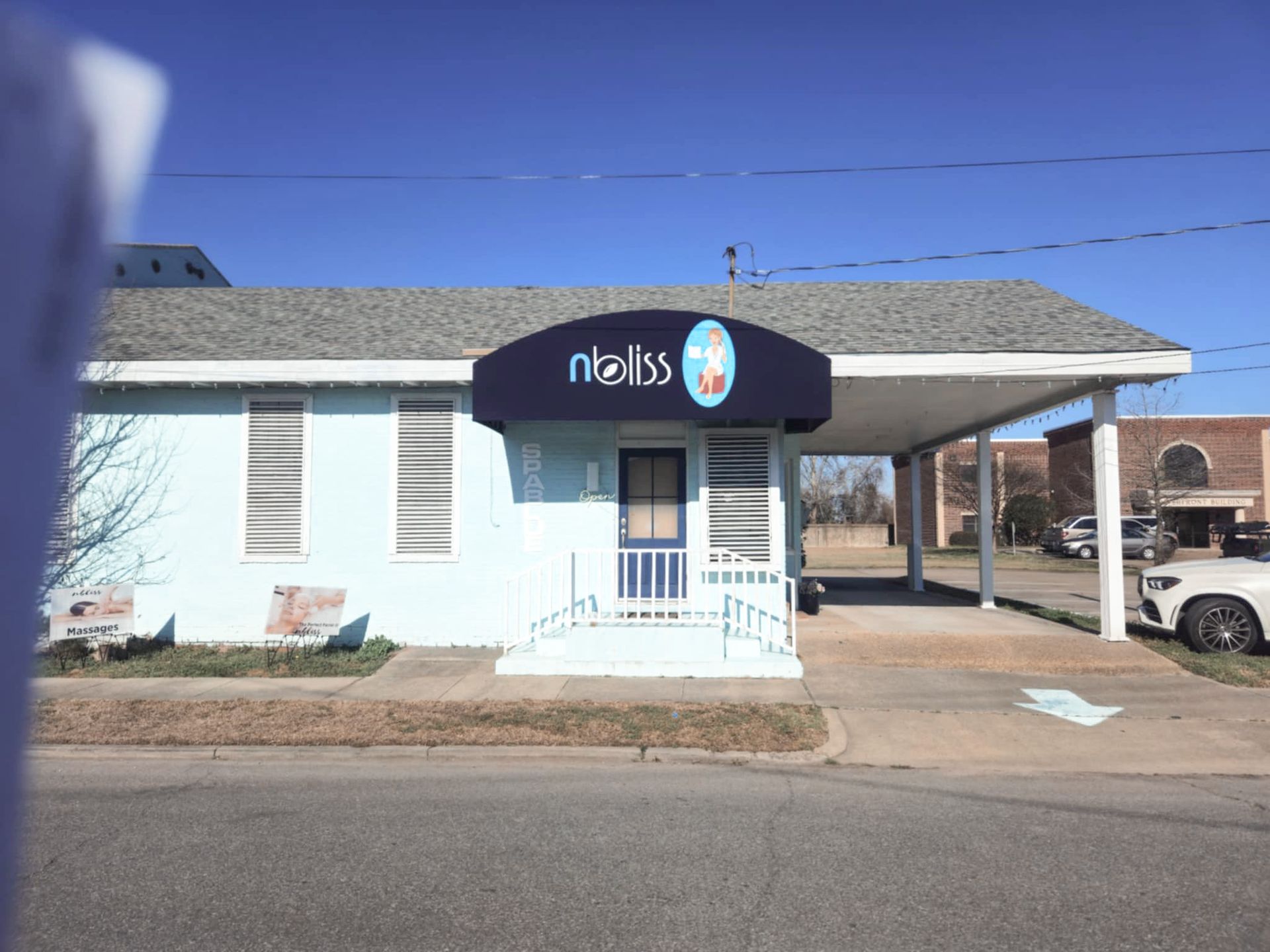 Light blue building with awning, 