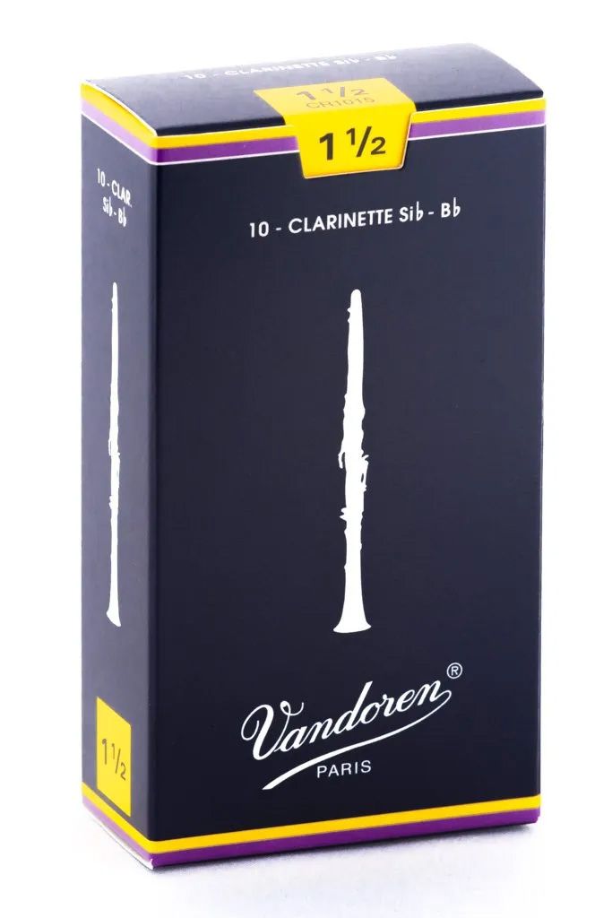 A box of Vandoren clarinet reeds, strength 1 1/2, on a dark background with yellow and purple accents.