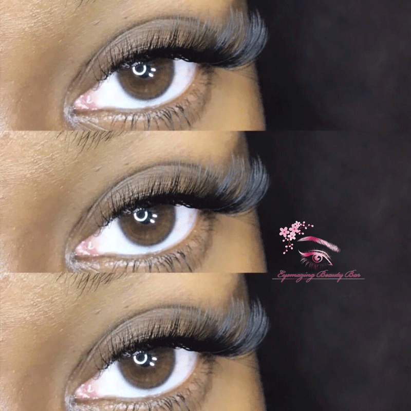 A close-up of a woman's eyes with long eyelashes.