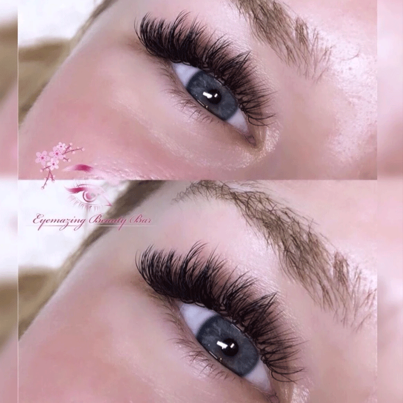 A close up of a woman 's eye with long eyelashes.