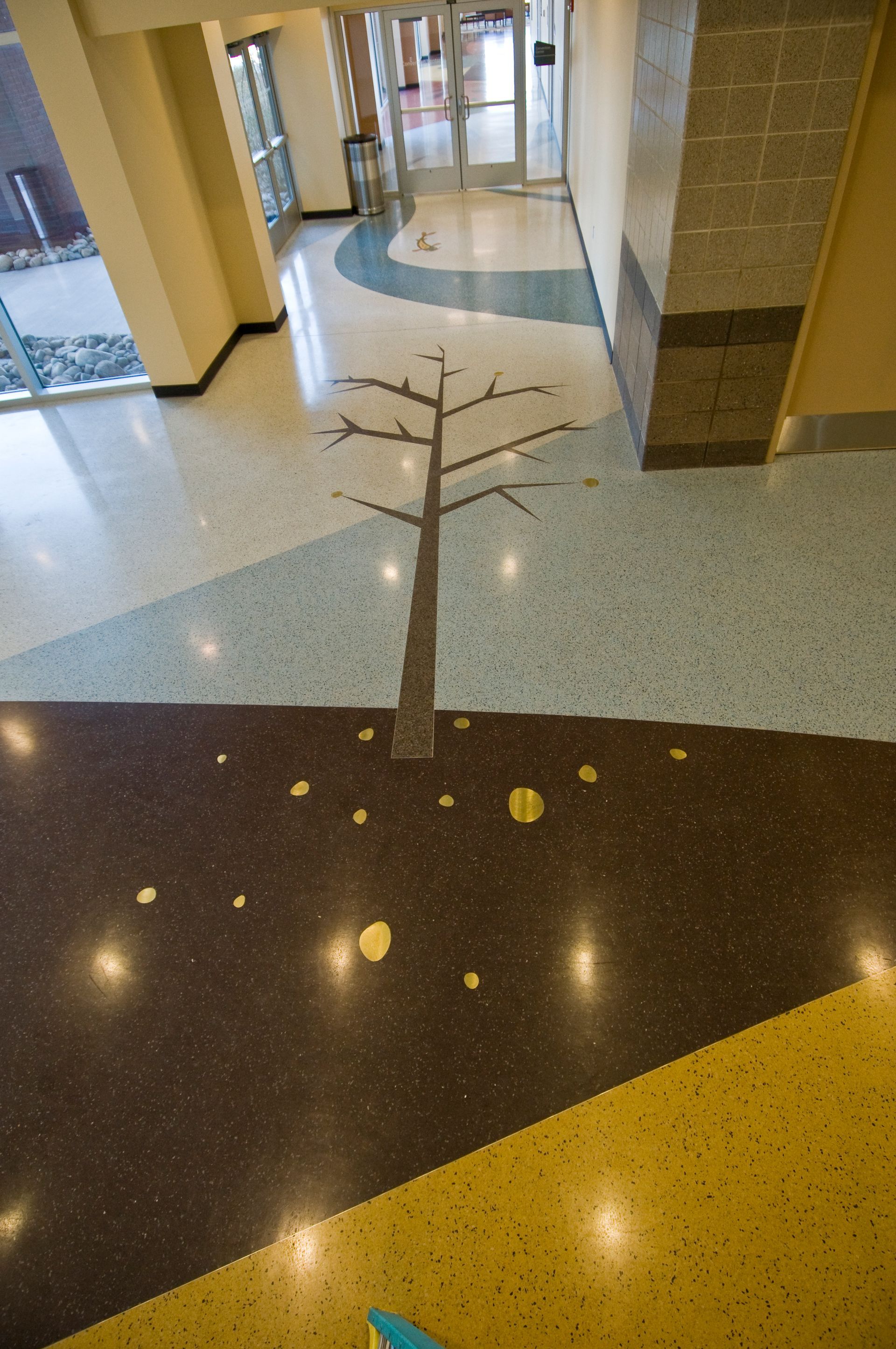 A tree is painted on the floor of a building