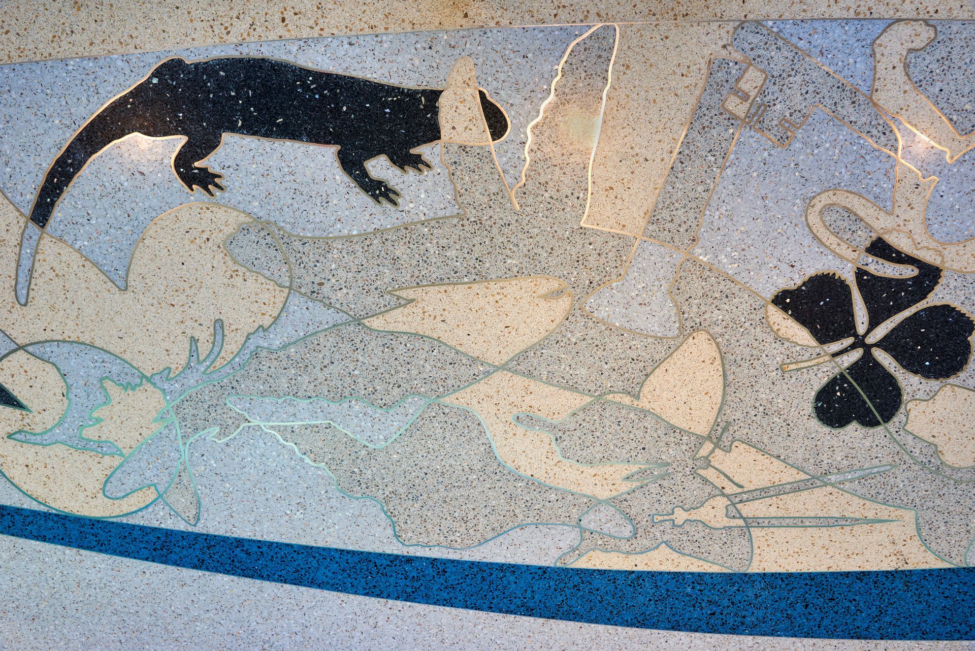 A painting of a lizard and a flower on a wall