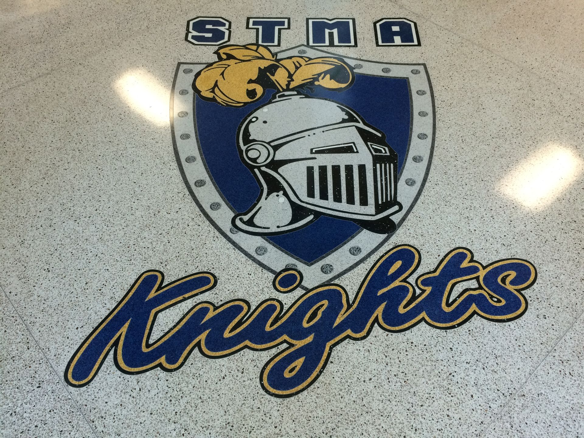 A logo for the sta knights is on the floor