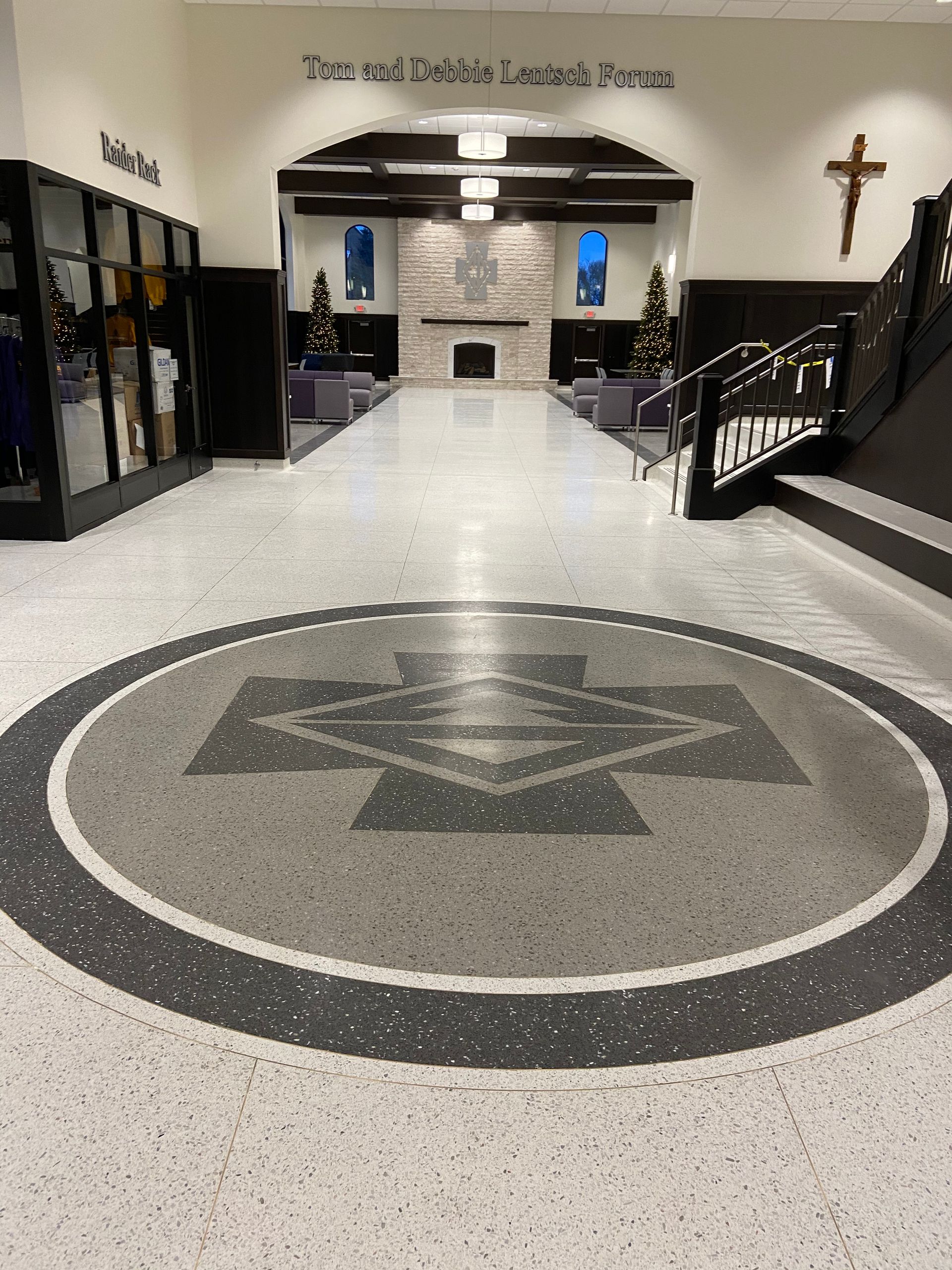 A church with a cross on the wall and a circle on the floor