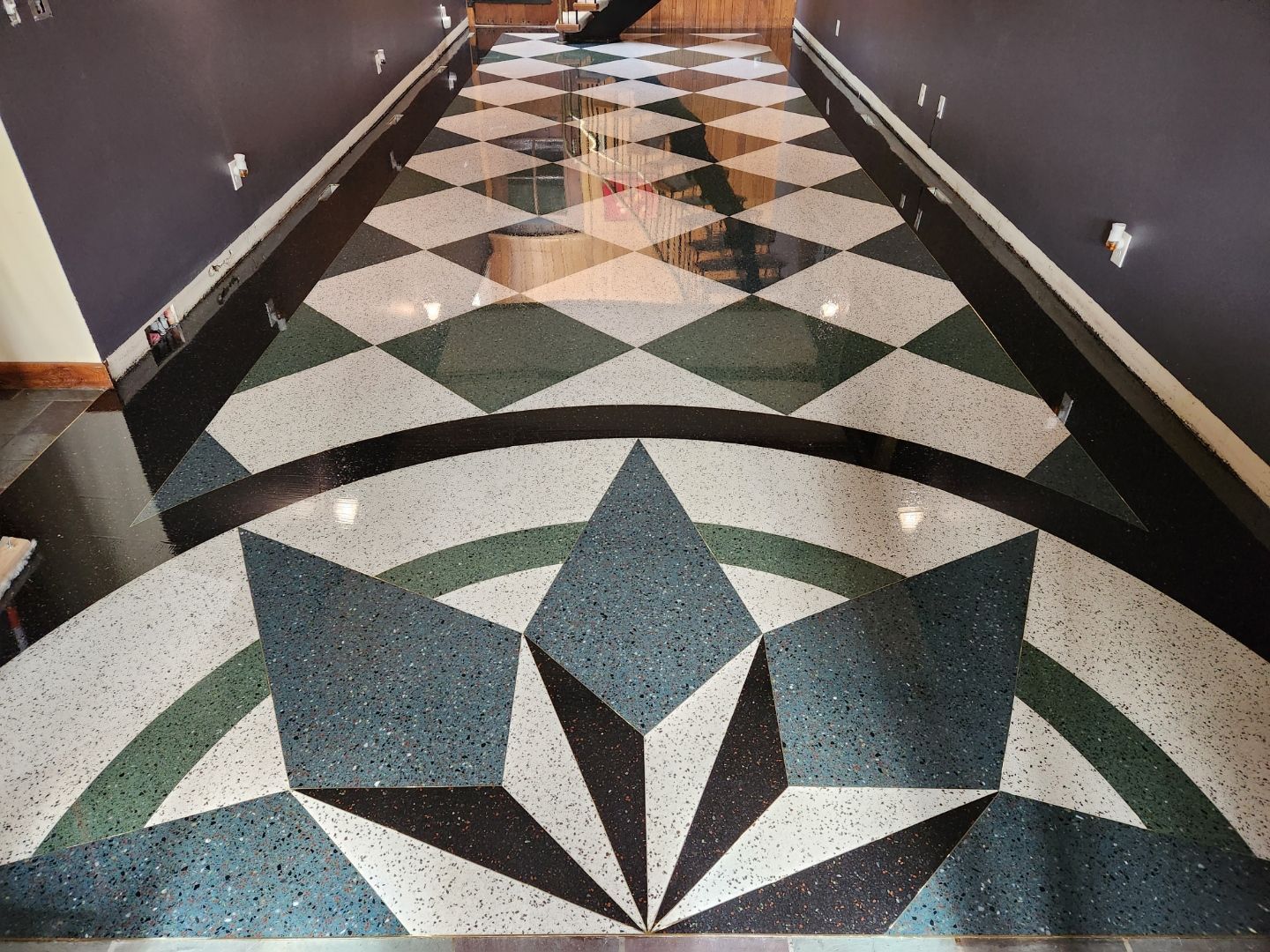 A hallway with a checkered pattern on the floor