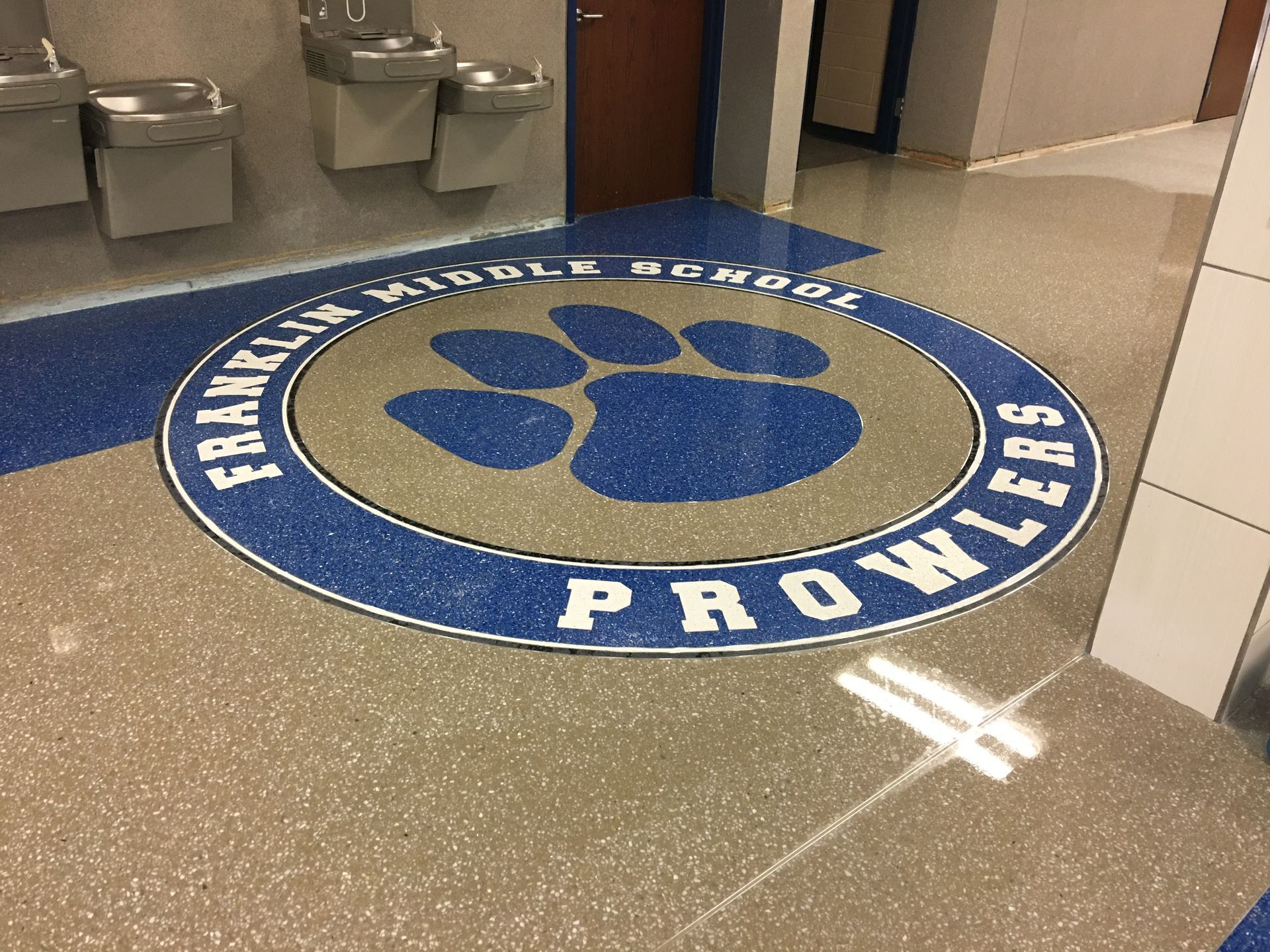 A logo for the franklin state prowlers is on the floor