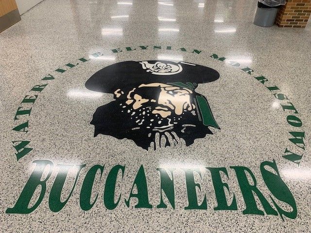 The buccaneers logo is on the floor of a building