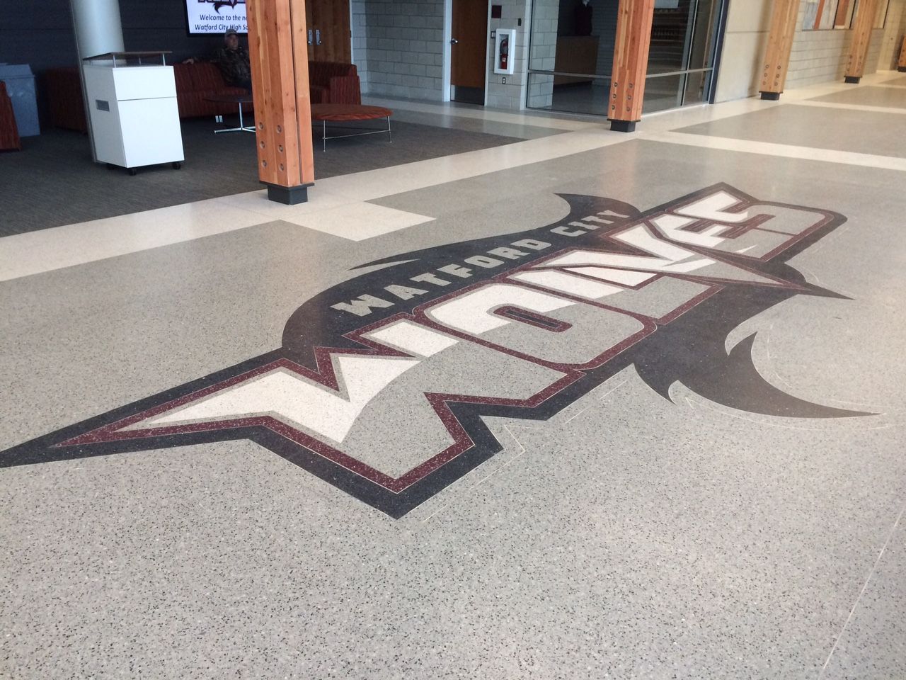 A logo for the waterloo wolves is on the floor