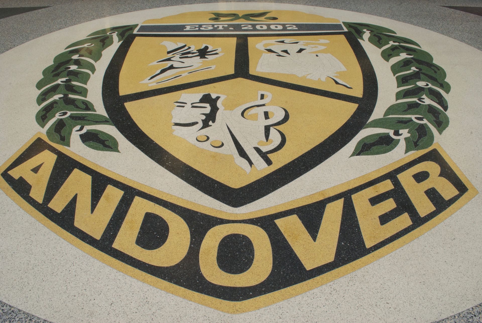 A logo for andover is on the floor
